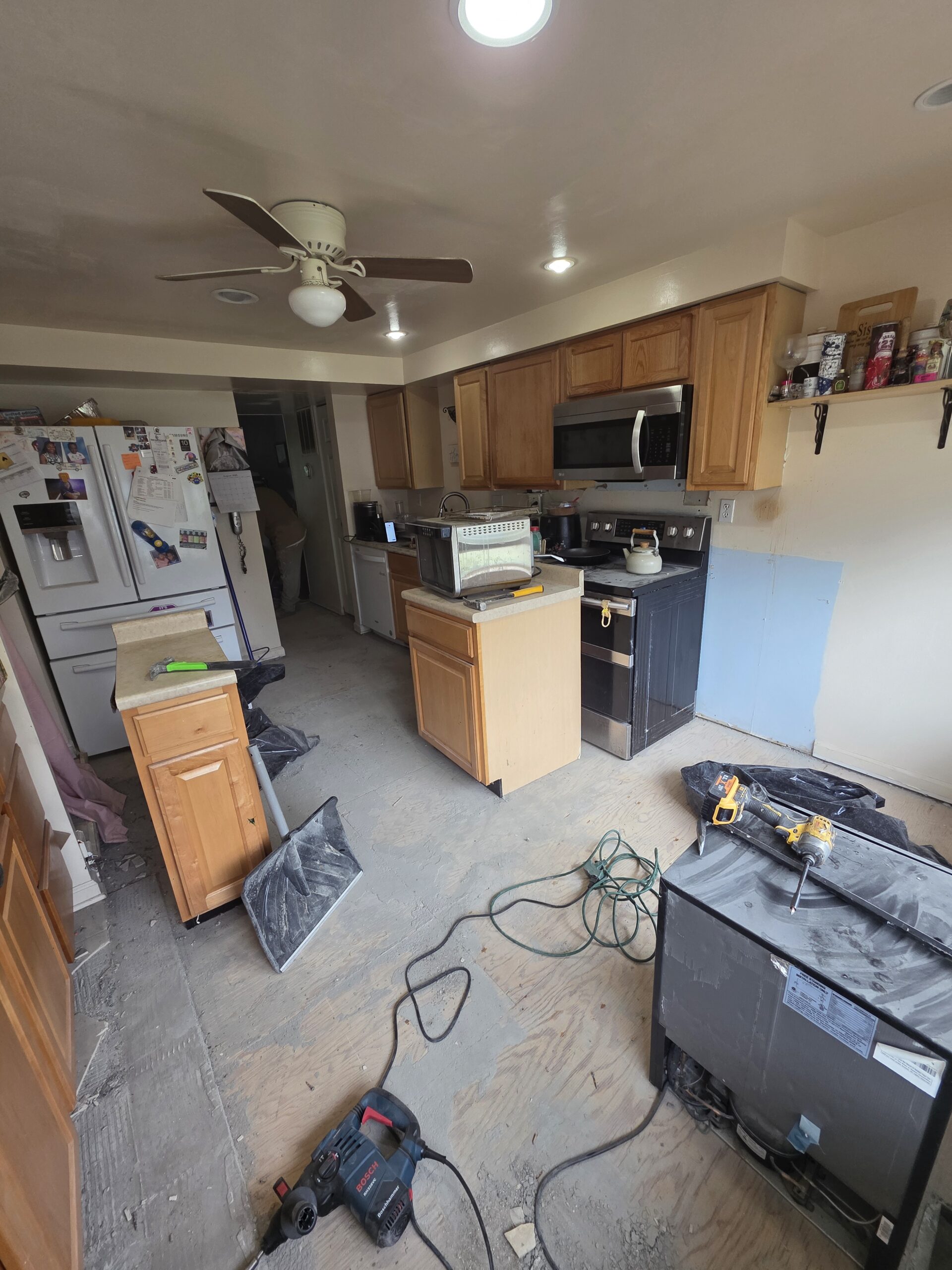 Kitchen cleared to the subfloor before FIXO installed new plank flooring