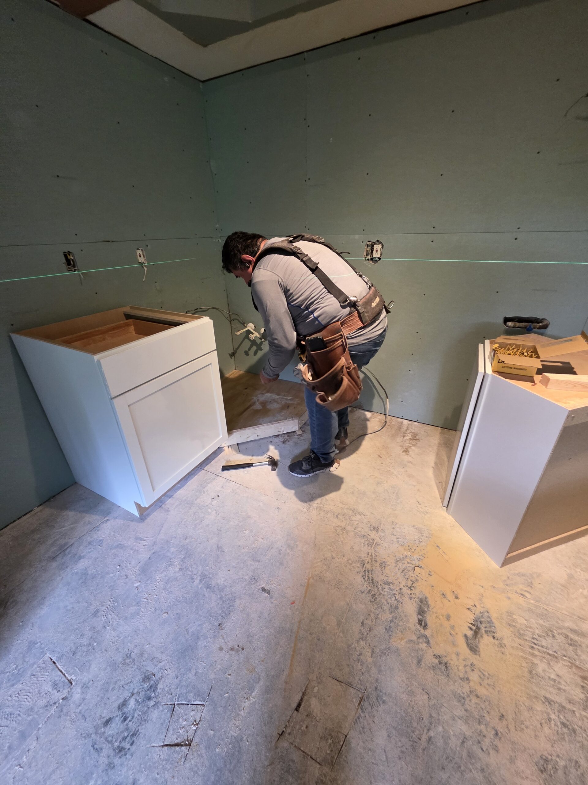 FIXO crew working on a prepped subfloor during a remodel