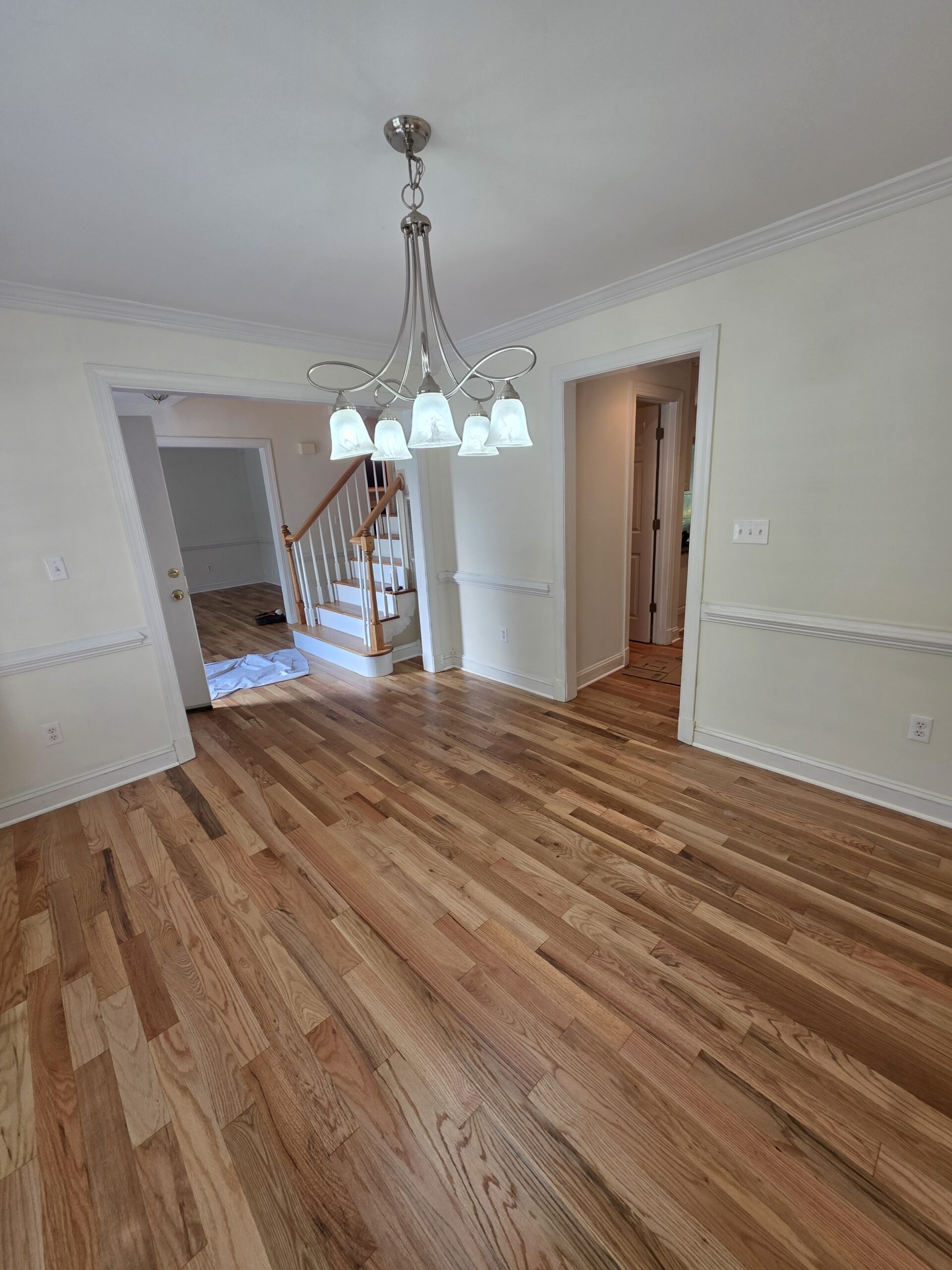 Finished natural oak hardwood flooring in a dining room