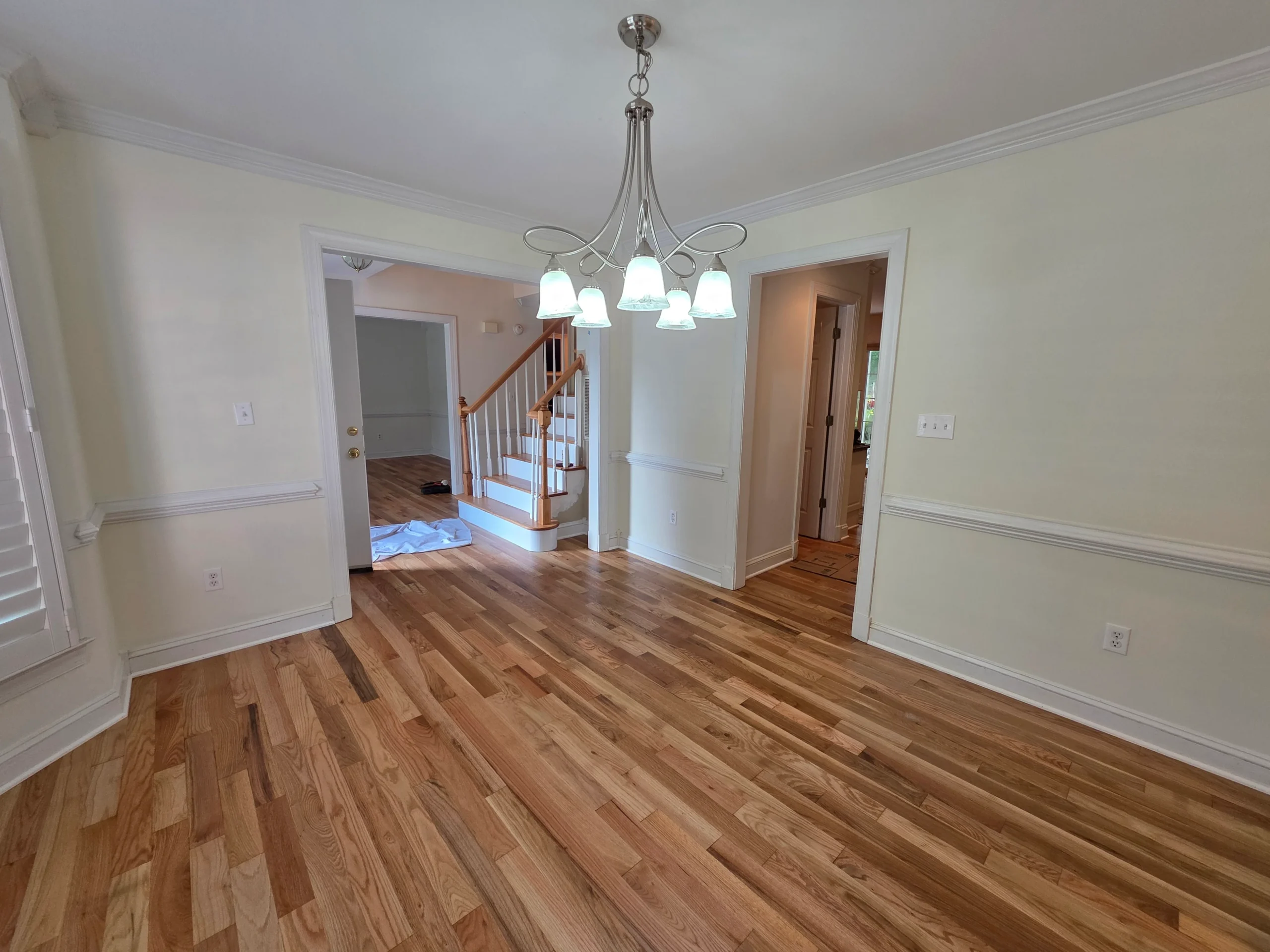 Finished hardwood carried from the dining room through to the staircase