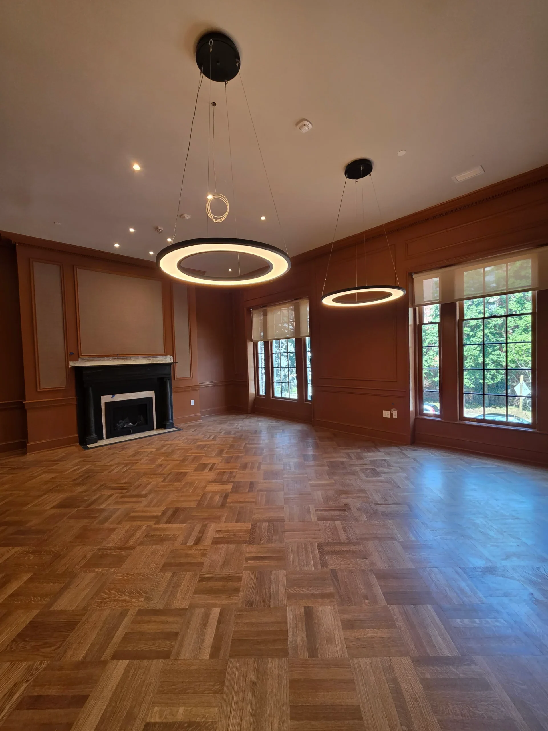 Finished herringbone wood flooring in a formal living room