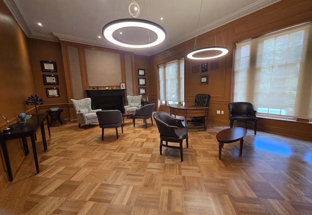 Parquet wood floor in a paneled office lounge, a project type commercial flooring contractors in Washington DC handle