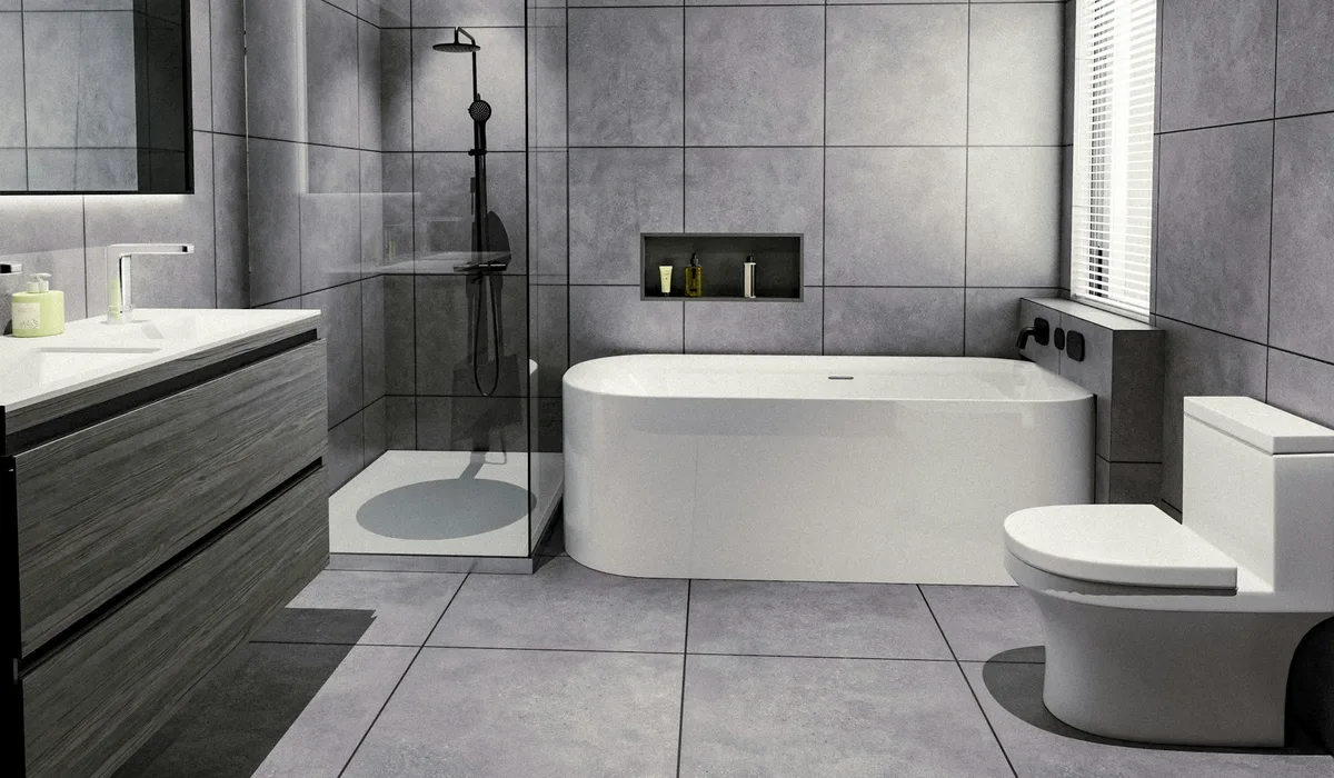 Bathroom floor tile installation finished in large grey tiles around a freestanding tub, vanity and toilet