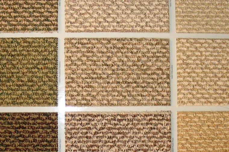 Berber carpet swatches showing loop textures and flecked colors, the first decision in any berber carpet installation