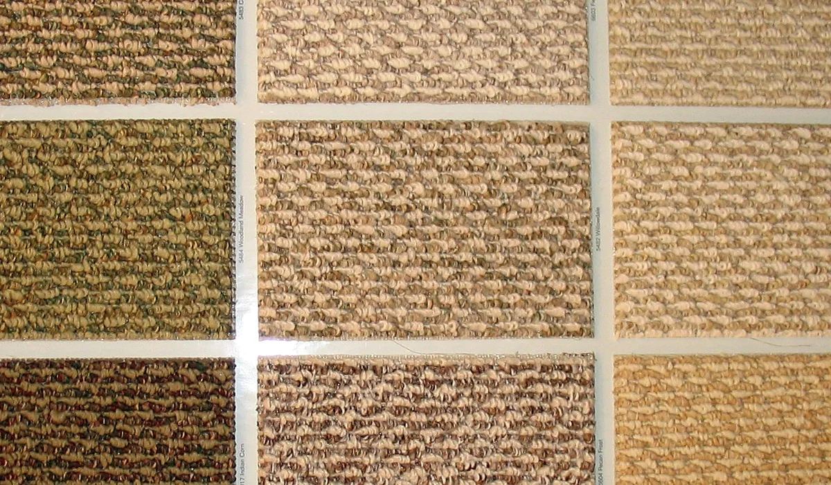 Berber carpet swatches showing loop textures and flecked colors, the first decision in any berber carpet installation