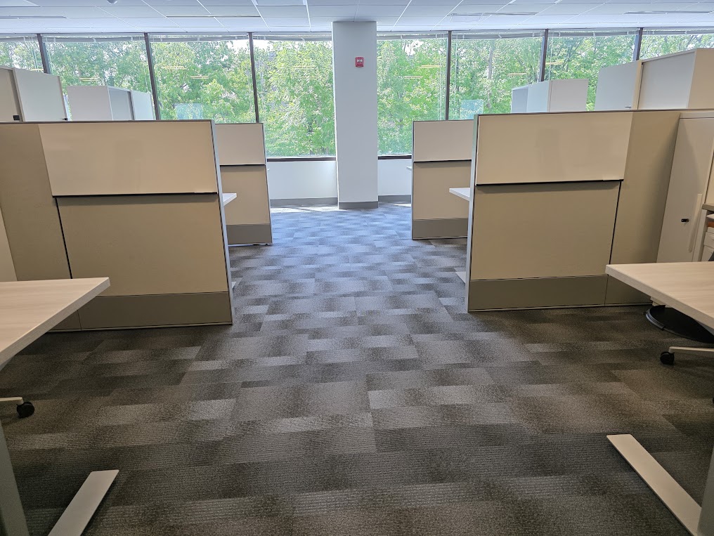 Gray carpet tile across an open office with cubicles, a typical job for commercial flooring contractors in Washington DC