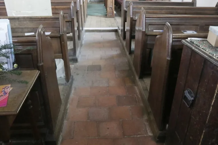 Commercial quarry tile installation: red square quarry tiles with wide grout joints