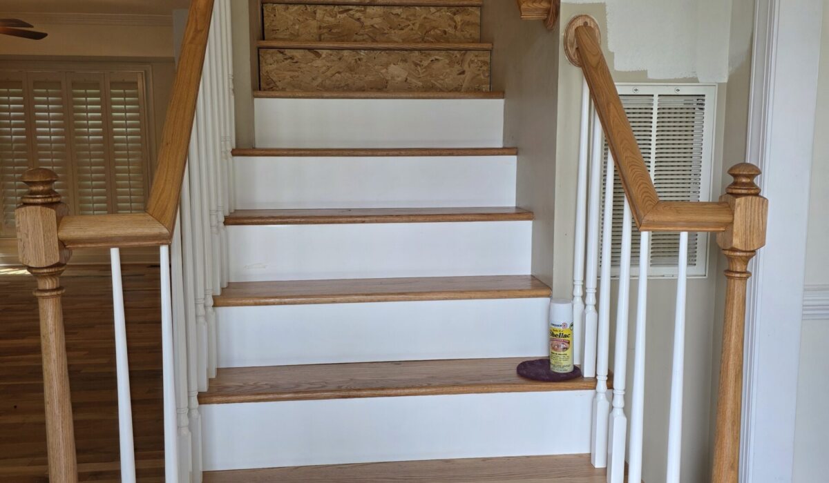 Stairs converted from carpet to hardwood treads with painted white risers
