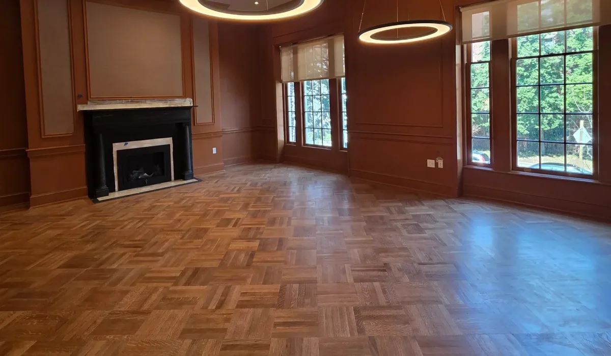 Finished herringbone wood floor in a formal living room