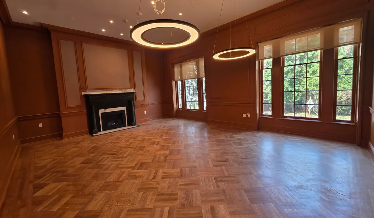Herringbone parquet floor in a wood-panelled function room