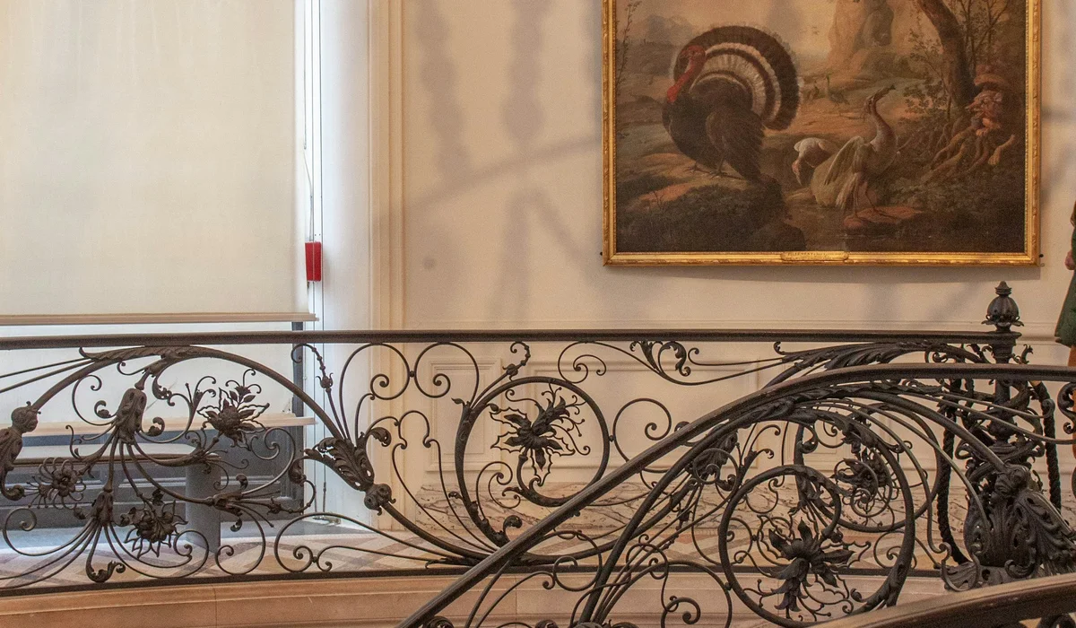 Ornate metal railing on a grand staircase