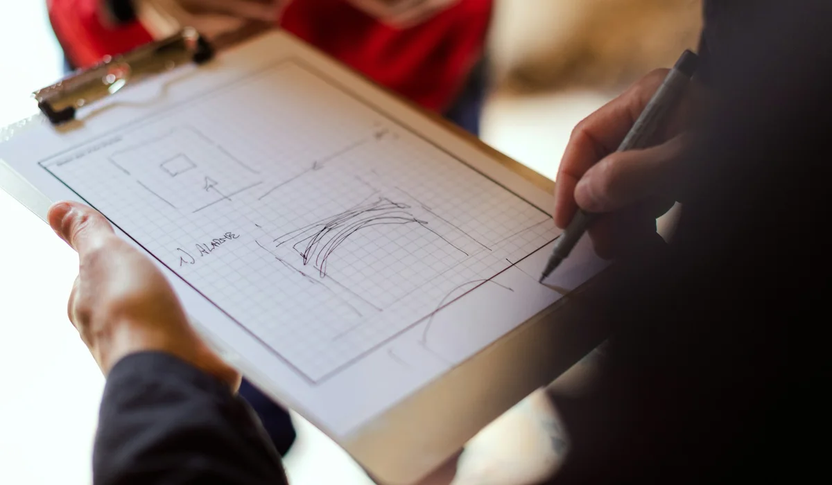 Room sketch with measurements on a clipboard during a flooring estimate