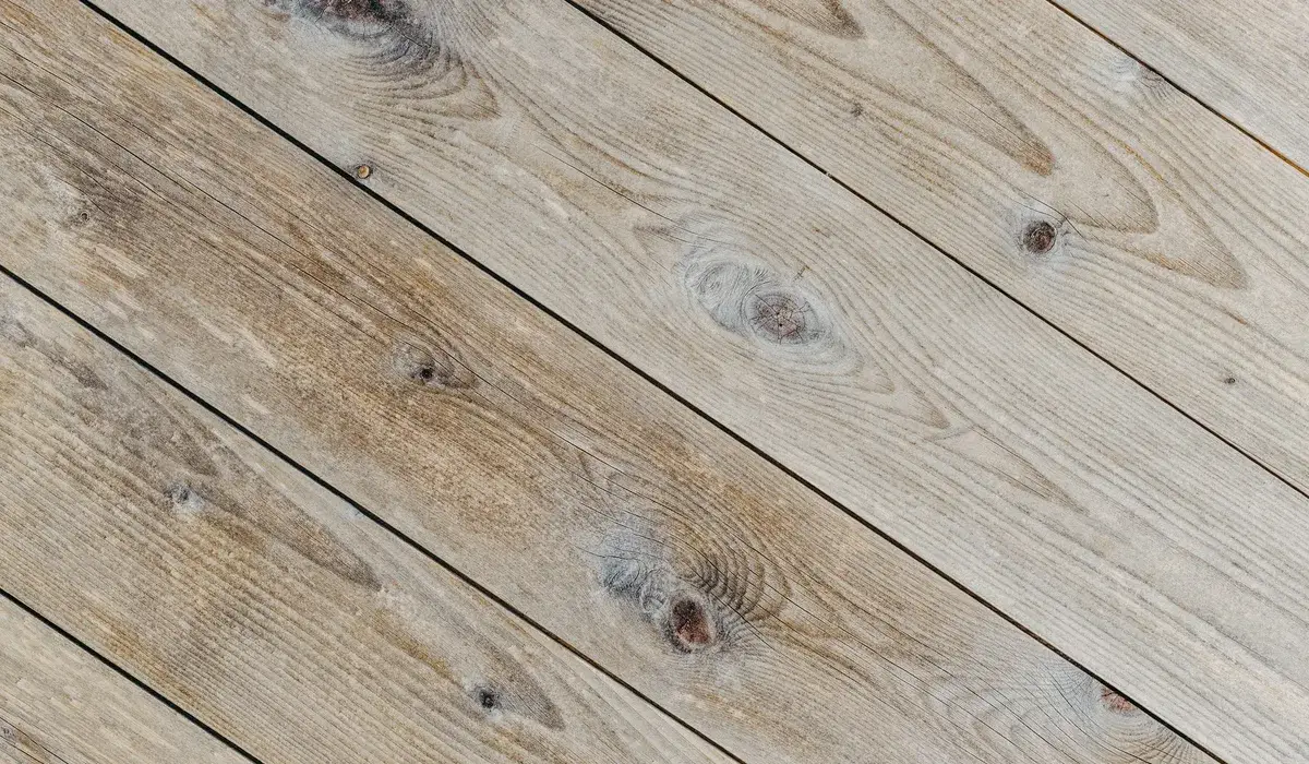 Rustic wood-look planks with heavy grain and dark knots, a visual that hides scuffs well