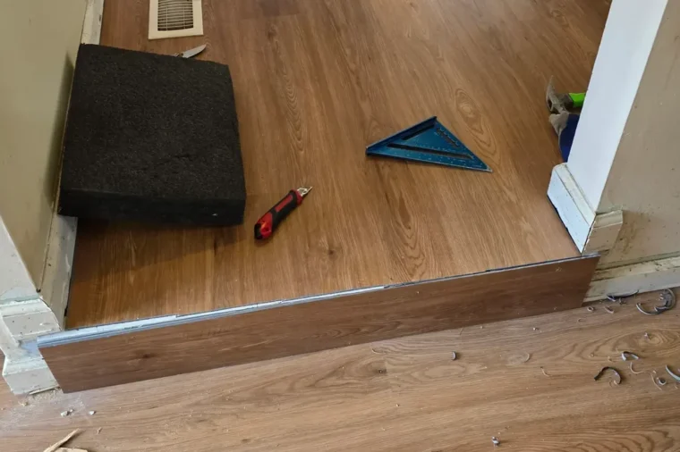 Vinyl flooring installation in Northern Virginia, wood-look planks laid down a hallway
