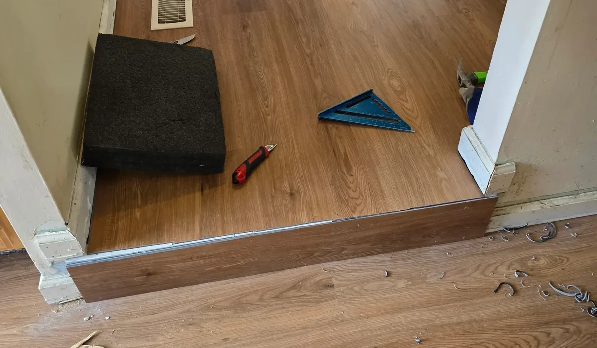 Vinyl flooring installation in Northern Virginia, wood-look planks laid down a hallway