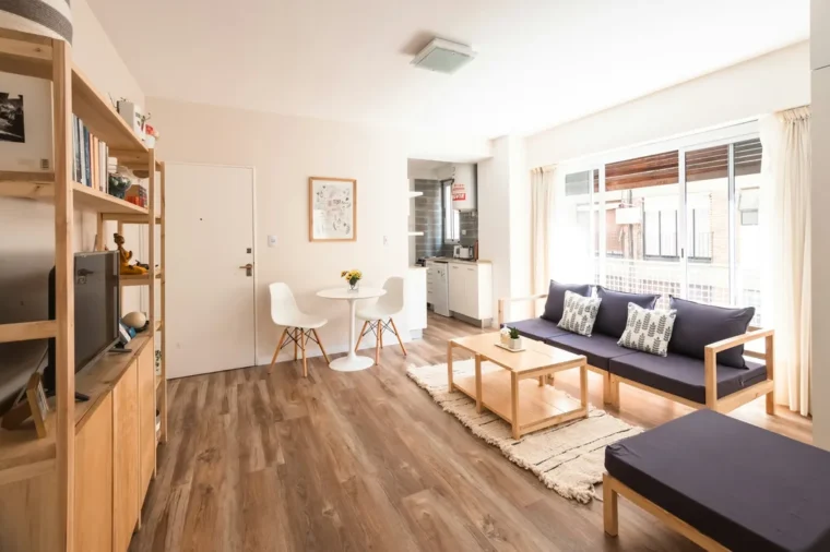 Light oak plank floor in an open living room, the look most vinyl wood flooring is designed to copy