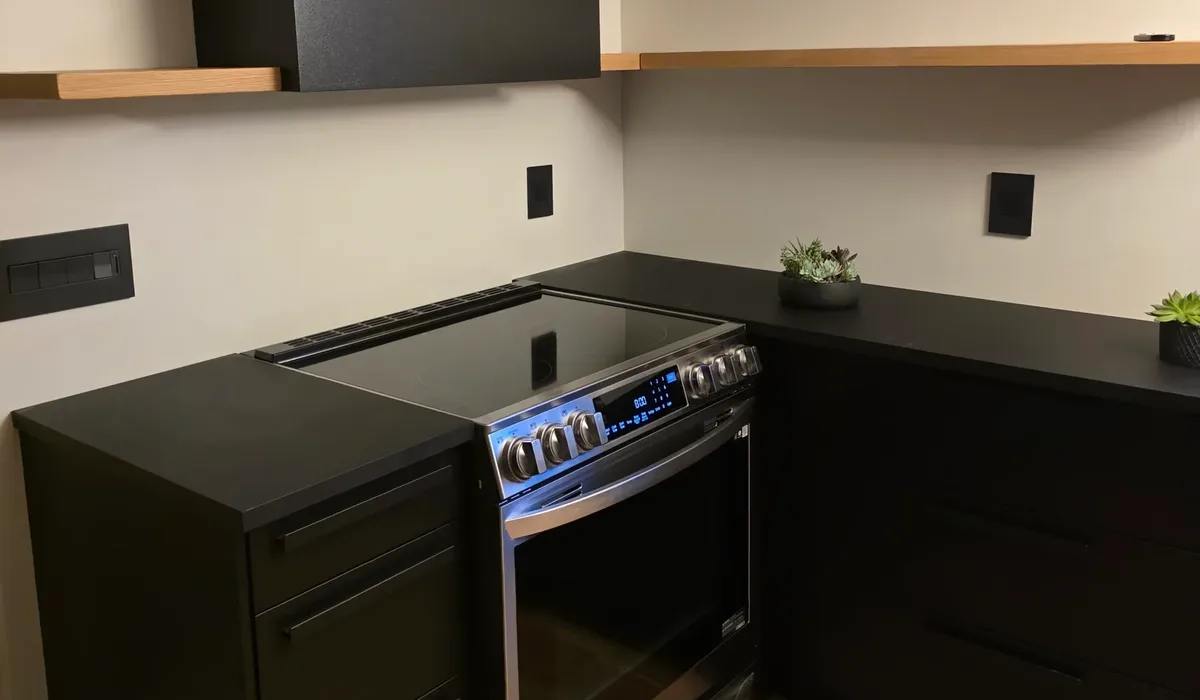 Modern kitchen with dark cabinets and new waterproof flooring