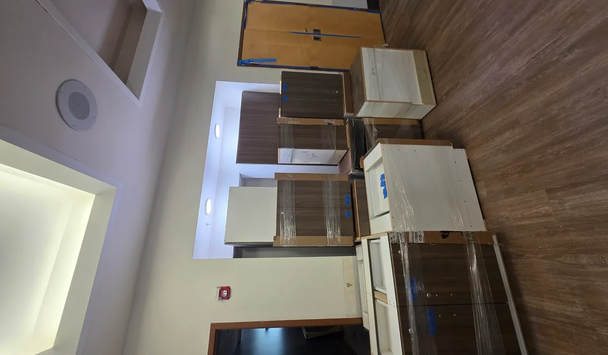Office kitchen with wood-look waterproof flooring and cabinetry